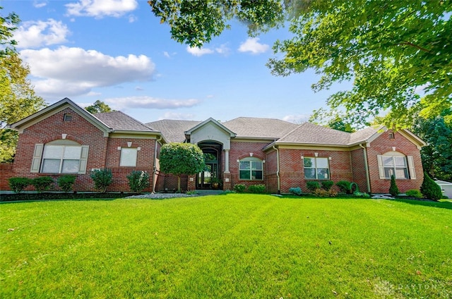 single story home featuring a front yard