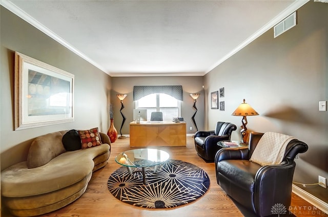 living room featuring crown molding and hardwood / wood-style floors