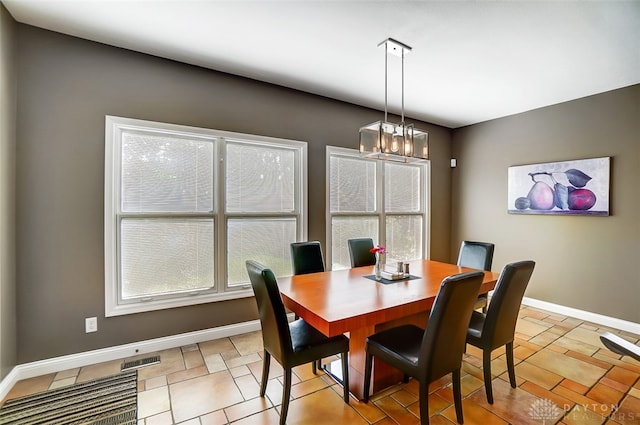 dining room with a chandelier