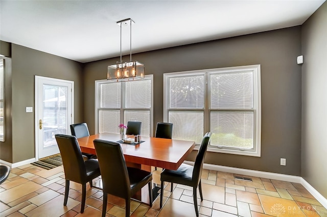 dining room with a chandelier