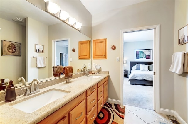 bathroom with tile patterned flooring and vanity