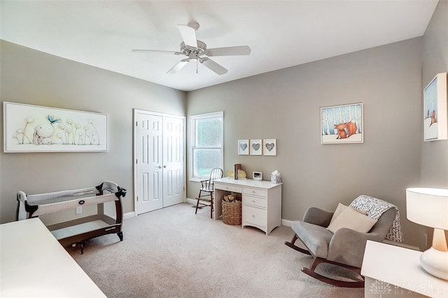 carpeted bedroom with a closet and ceiling fan