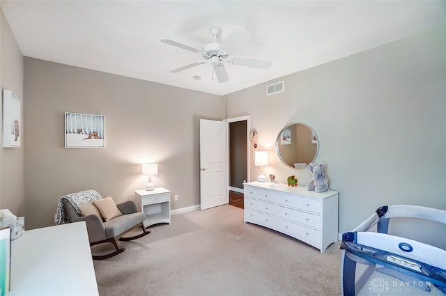 carpeted bedroom with ceiling fan