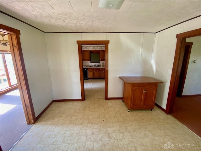 unfurnished room featuring ornamental molding