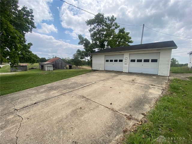 garage with a lawn