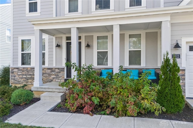 entrance to property featuring a porch