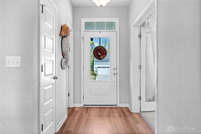 doorway to outside featuring light wood-type flooring