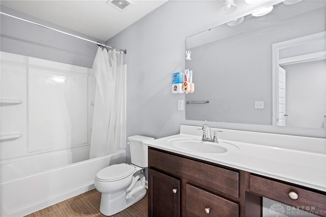 full bathroom with vanity, toilet, and shower / bath combo with shower curtain