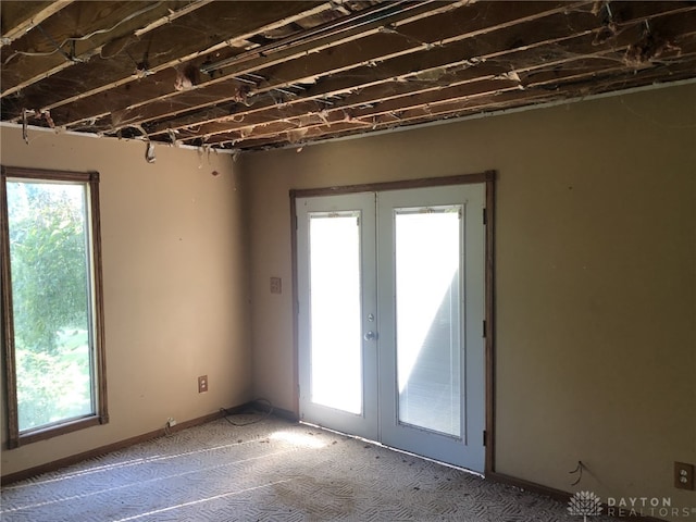 interior space featuring carpet and french doors