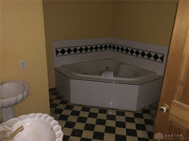 bathroom with a relaxing tiled tub