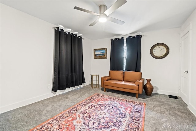 sitting room with carpet and ceiling fan