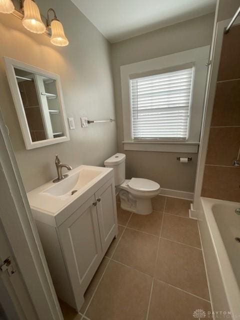 full bathroom with toilet, bathing tub / shower combination, tile patterned floors, and vanity