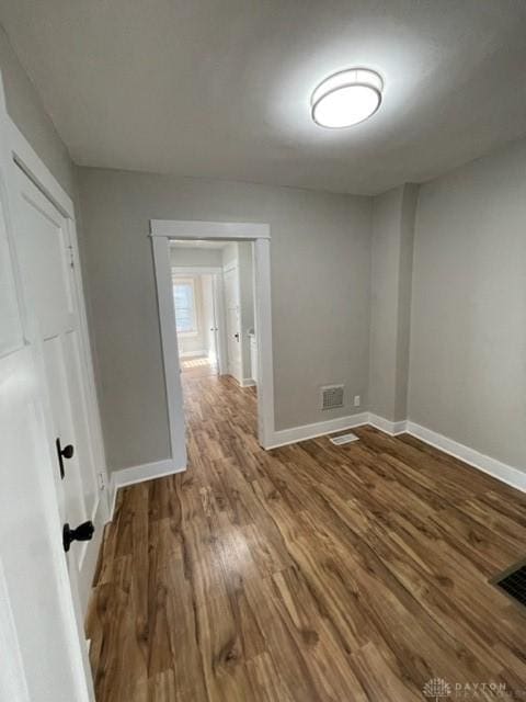 spare room with wood-type flooring