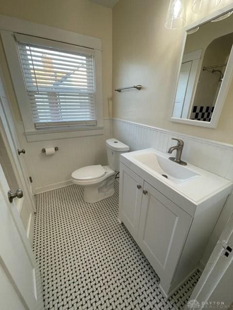 bathroom with tile patterned floors, toilet, and vanity