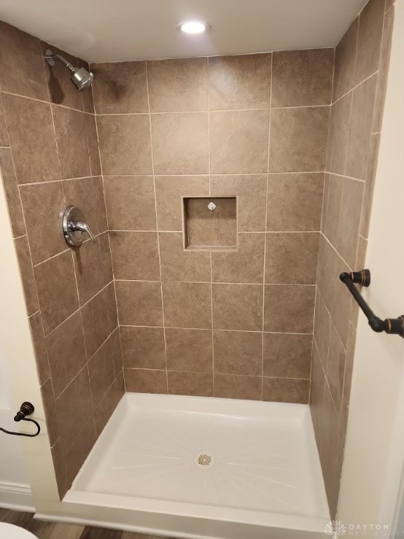 bathroom with tiled shower