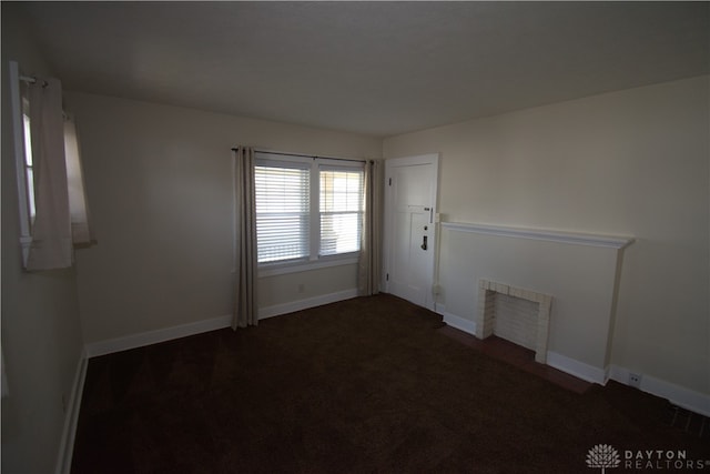 empty room featuring a fireplace