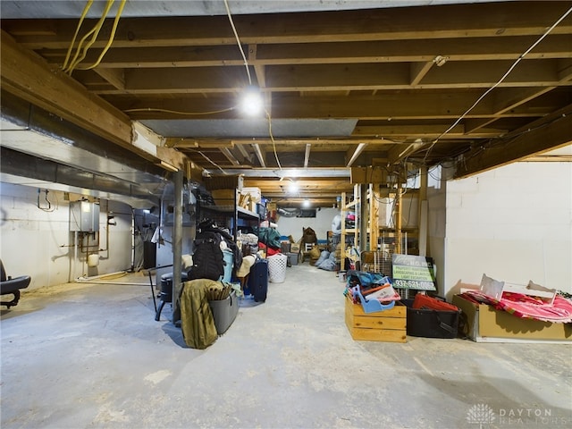 basement featuring electric panel