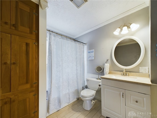 full bathroom with a textured ceiling, toilet, wood-type flooring, vanity, and ornamental molding