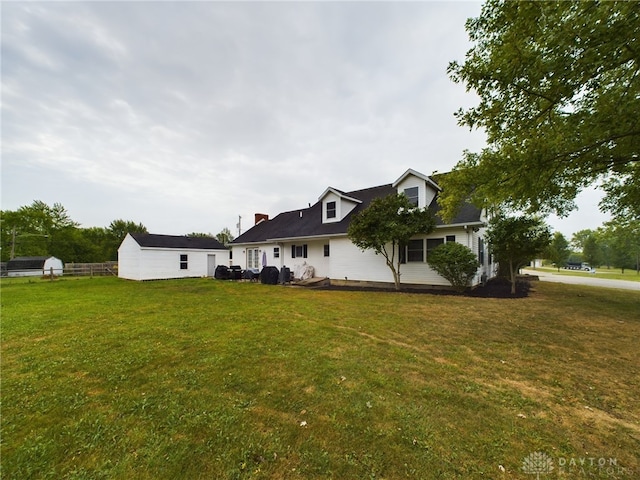 view of home's exterior featuring a yard