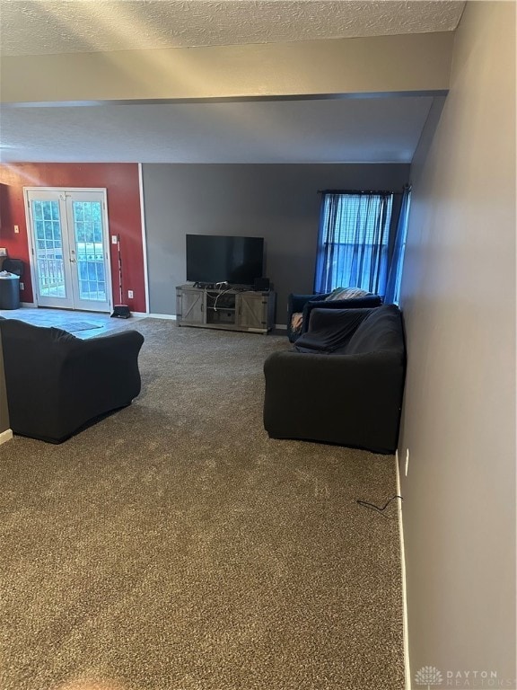 living room with carpet and a textured ceiling