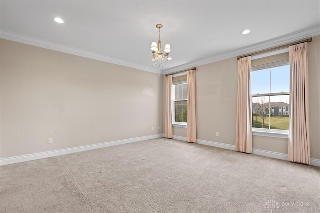 spare room with light carpet, a chandelier, and crown molding