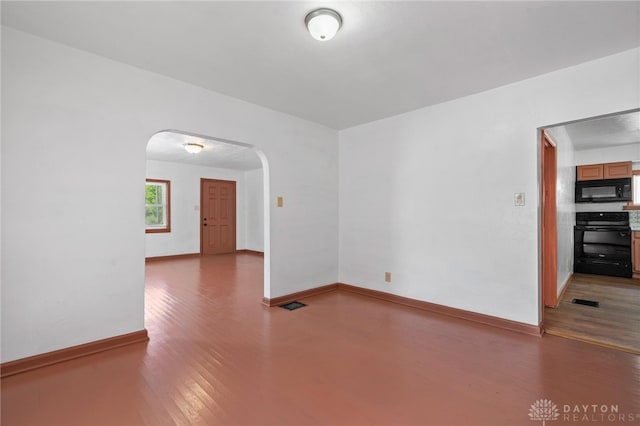 unfurnished room featuring dark hardwood / wood-style floors