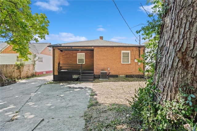 back of property with central AC unit