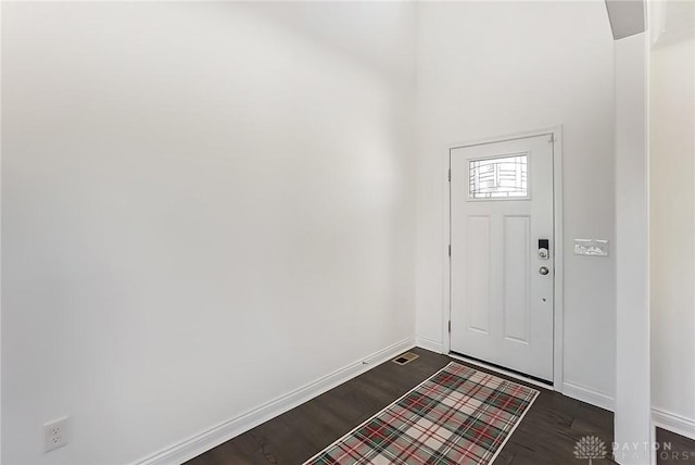 entrance foyer featuring dark hardwood / wood-style floors