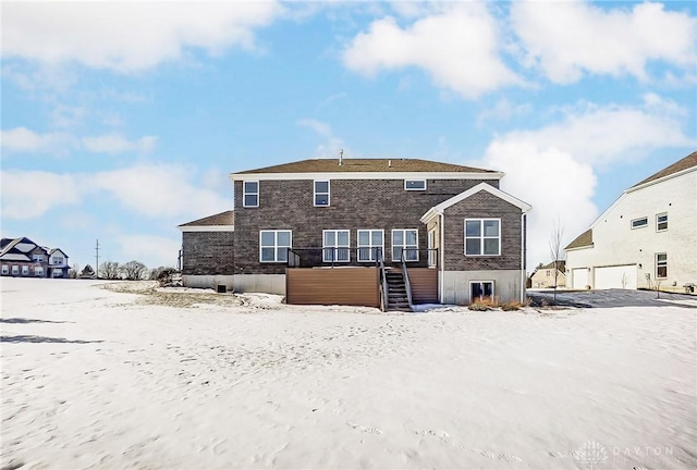 view of snow covered house