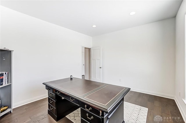 home office with dark wood-type flooring