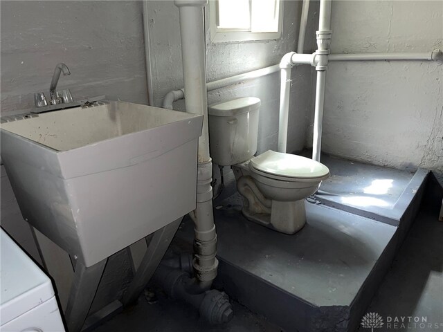 bathroom with toilet and sink