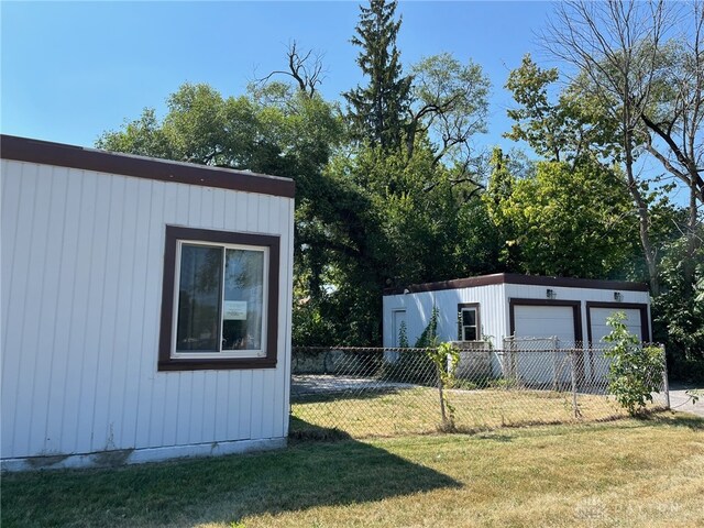 view of outbuilding featuring a lawn