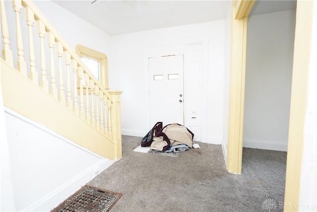 view of carpeted entrance foyer