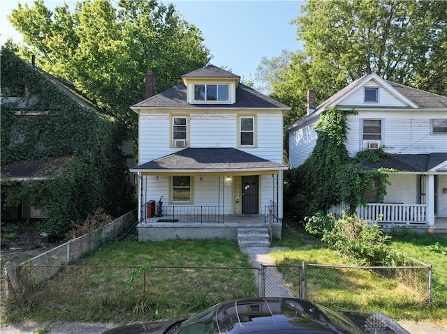 view of front facade with a porch and a front lawn