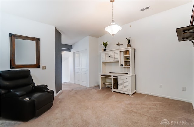 living area with light carpet and vaulted ceiling