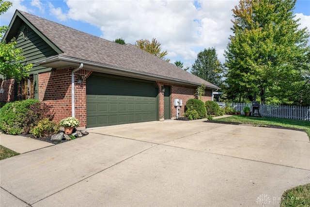 view of side of property featuring a garage