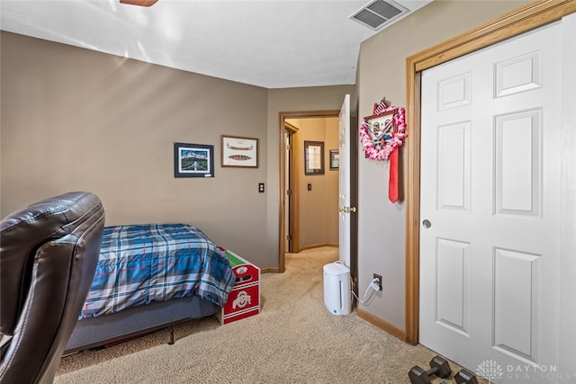 bedroom with light colored carpet