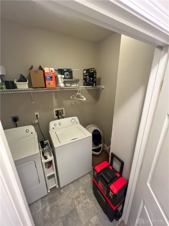 laundry room with washing machine and dryer