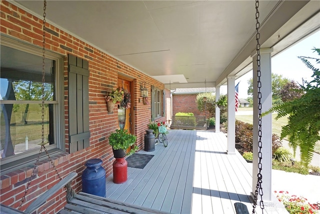 wooden terrace with a porch