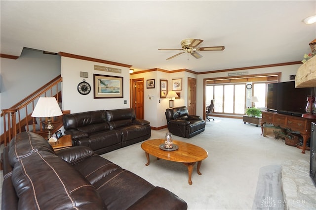 living room featuring crown molding, light colored carpet, and ceiling fan