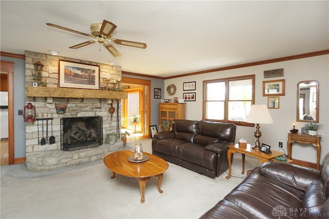 living room with a fireplace, light colored carpet, ornamental molding, and ceiling fan