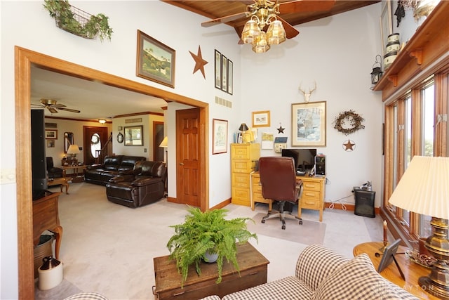 home office with light carpet, beamed ceiling, a high ceiling, and ceiling fan