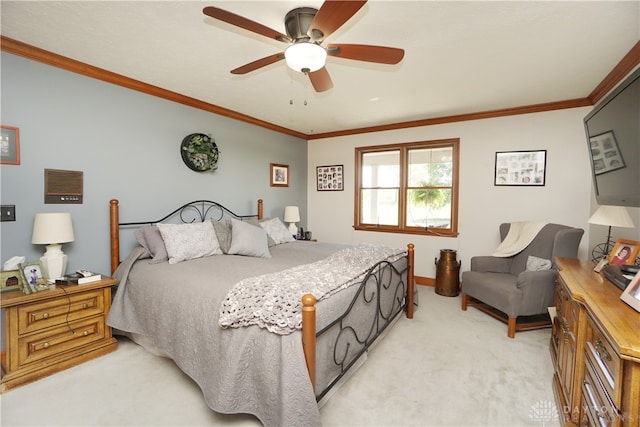 bedroom featuring crown molding, light colored carpet, and ceiling fan