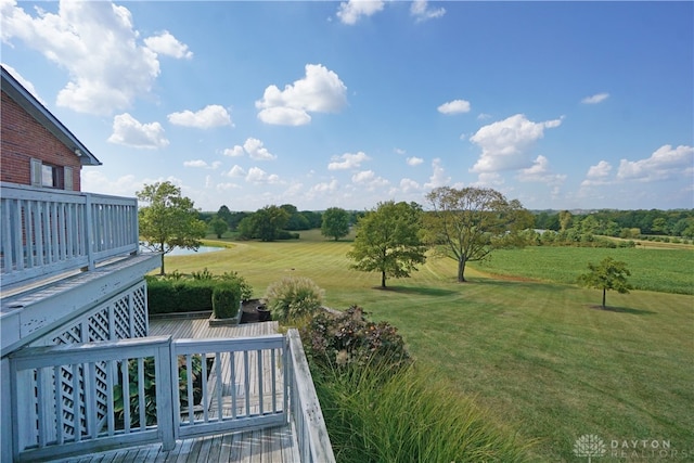 view of yard featuring a deck with water view