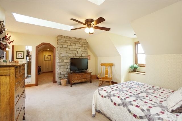 bedroom with vaulted ceiling, ceiling fan, and carpet floors