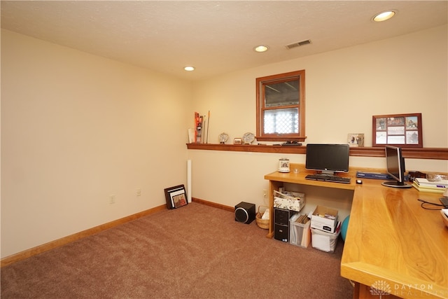 office area featuring built in desk and carpet floors