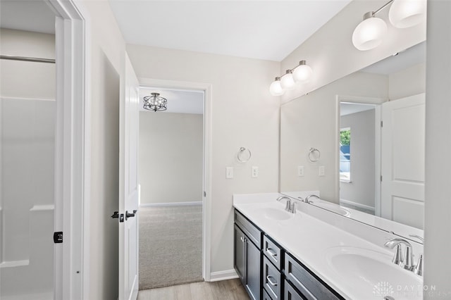 bathroom featuring hardwood / wood-style flooring and vanity