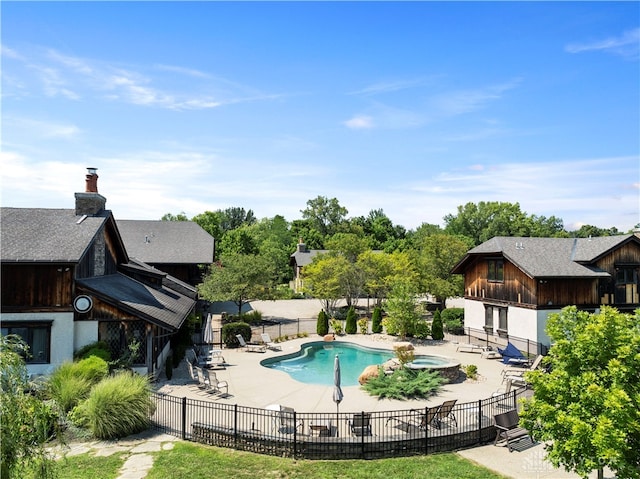 view of swimming pool with a patio area