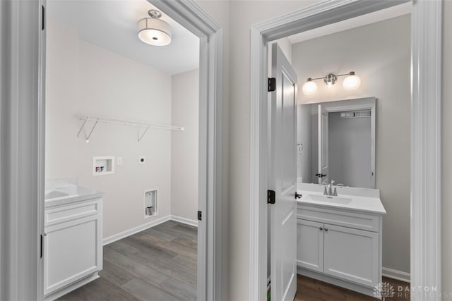 bathroom with vanity and hardwood / wood-style floors