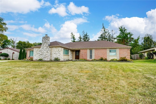 single story home with a front lawn